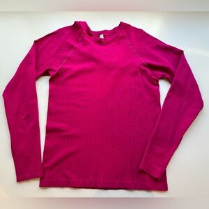 Athleta Momentum long sleeve top. Pink w orange swirls. Size M.